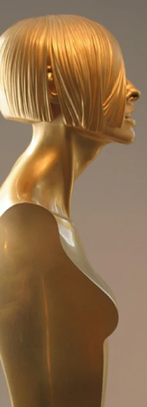 Profile of a gold-toned bronze female figure with a precisely sculpted bob haircut